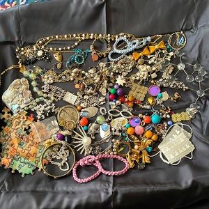 Assortment of broken jewelry; beads, chains, charms and etc.